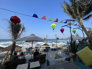 View of the beach (can also use the deckchairs on the beach)   at The Fisherman Vegan Restaurant   in Hoi An