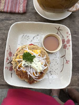 Pancakes with banana and strawberry in the middle   at The Fisherman Vegan Restaurant   in Hoi An