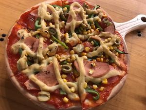 the vegan ham and cheese and green olive pizza - great  at The Fisherman Vegan Restaurant   in Hoi An