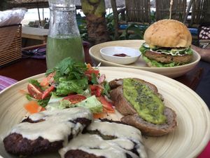 Vegan burger with falafel served with avocado on bread.   at The Fisherman Vegan Restaurant   in Hoi An