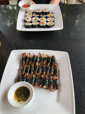 Korean sushi (top); grilled mushrooms in piper lollot leaves (bottom)  at Phong Nha Vegan in Phong Nha