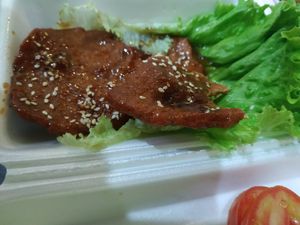 Pork with lemongrass, 3 thin slices and one lettuce leaf at Phong Nha Vegan in Phong Nha