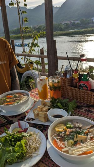 Thick noodle and vegetable soup, fried tofu, iced kumquat green tea, iced mango and coconut smoothie at Phong Nha Vegan in Phong Nha