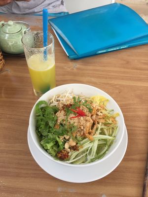 pineapple juice and rice noodle dish (forgot name) at Phong Nha Vegan in Phong Nha