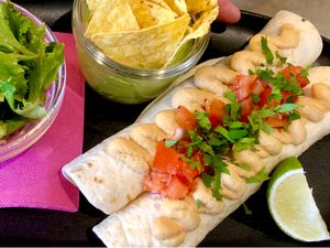 Vegan Bean Burrito with hummus, salsa. Guacamole & Chips. Green salad.  at Milwaukee Cafe in Biarritz
