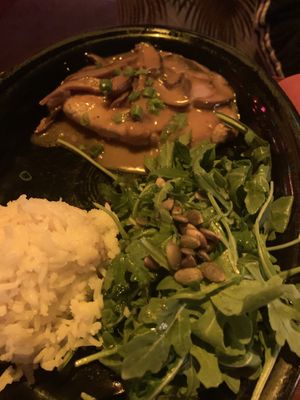 Chick’n in shitake gravy with rice and arugula salad  at Hula's Island Grill in Santa Cruz