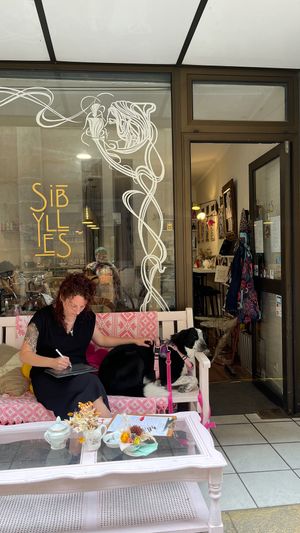 Mëlinka (une des tatoueuses de l'équipe), avec Koda, notre chien d'accueil à mi-temps !  at Sibylles - Tattoo Salon & Tea Room in Bordeaux