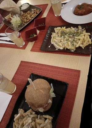 Tacos Mexicanos (vegan), homemade Lemonade, meat balls with tomato salsa (vegan), patatas al estilo chef (vegetarian), plato unico hamburger (vegetarian)  at Raices in Granada