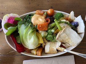 Tofu bowl with mixed vegetables and grains underneath at Rabano in Hermosa Beach
