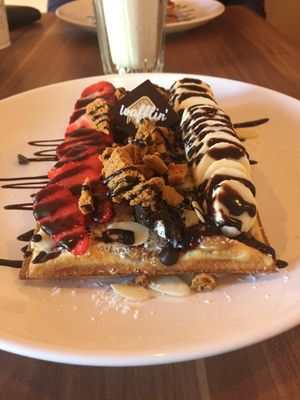 Amazing vegan waffle. Banana, strawberries, lotus spread and pieces, almond slices, coconut flakes, raspberry jam, dark chocolates chips and chocolate sauce.  at Cafe Waffle in Prague