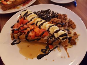 Lotus biscuits, banana, strawberry, maple syrup and some Oreos on top at Cafe Waffle in Prague