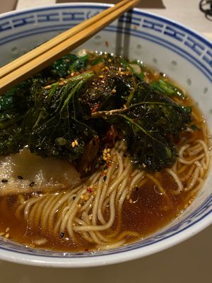 Shoyu ramen, jerusalem artichoke, cripsy kale, pickled pear and chili powder. at Pink Head Noodle Bar in Malmo