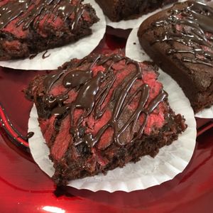 Cake brownies with strawberry sauce and chocolate ganache at You Eat I Bake in Myrtle Beach