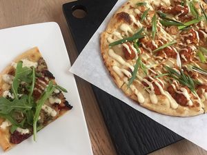 A slice of Pesto CBR and Stranger Wings. Both good! at Virtuous Pie - UBC in Vancouver