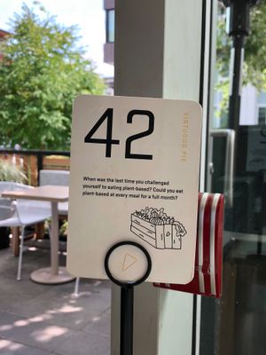 A gentle nudge for the non-veggie patrons to consider veganism...whilst they await the food with the highest likelihood of achieving that goal. at Virtuous Pie - UBC in Vancouver