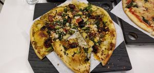 Ultraviolet pizza  -so delicious we ate a bite before remembering to take a pic at Virtuous Pie - UBC in Vancouver