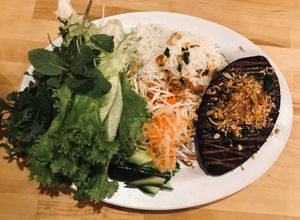 Ocean of love: fried seaweed wrapped bean curds, topped w/ fried onion, garlic sesame seed and peanut
 at Merit Vegan Restaurant in Sunnyvale