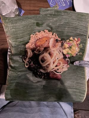 Banana leaf plate: rice, beans, plantains, onions and mango salad  at Riverwalk at Tin City in Naples