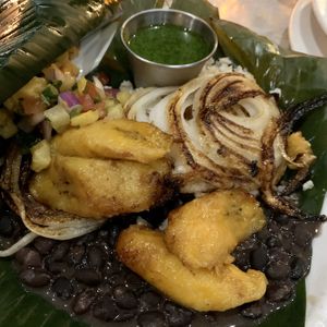 Banana leaf stuffed with rice, plantains, beans, chimichurri, onions at Riverwalk at Tin City in Naples