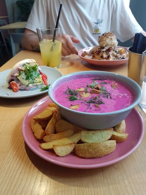 Cold beetroot soup, jackfruit loaded potatoes in the back and bao with teriaky tempeh. at RoseHip Vegan Kebabs in Vilnius