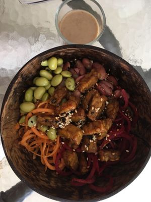 Super bowl with Tempe turmeric, edamame, red beans, beet root, carrots, red rice and peanut sauce at Griya Super Food in Ubud