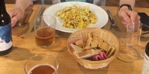 Vegan paella, bread basket and artisanal beers at Bar Ecologico Gaia in Sevilla