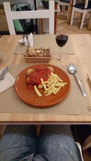 Albóndigas de soja en salsa de tomates y patatas fritas at Bar Ecologico Gaia in Sevilla