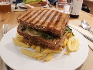 Triple sandwich. Loved the chips, salad and vegan cheese. Not so keen on the tempeh. at Bar Ecologico Gaia in Sevilla