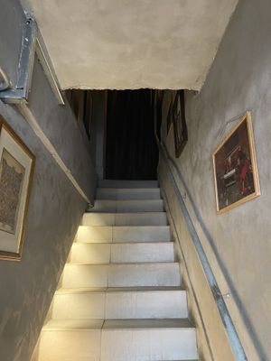 Go up the stairs it’ll lead you to the reception area and first floor  at Monk's Butcher - Itaewon in Seoul