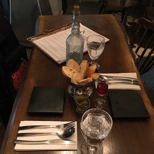 Basic setting with Water, welcome drink, bread and olives?Nice!  at Monk's Butcher - Itaewon in Seoul