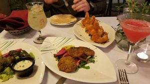 Dolmas, falafel with vegan tzatziki sauce and the best harissa orange panko breaded cauliflower. Yum!!  at Soro's Mediterranean Grill in Temecula