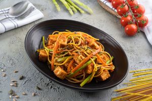 crispy tofu quinoa noodles with carrot, zucchini, noodles & toasted pumpkin seeds at Café 302 in Abu Dhabi