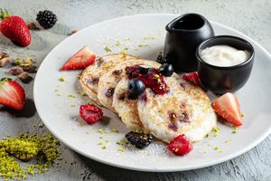 Blueberry Rice Pancake with wild berries & maple syrup at Café 302 in Abu Dhabi