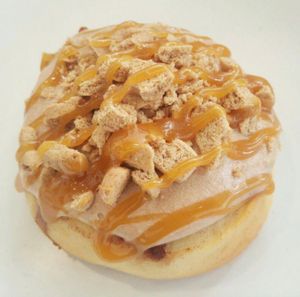 Twix! Chocolate Frosting with Cookie Pieces & Caramel Sauce! at Cinnaholic in Boca Raton