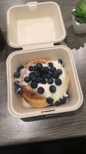 Chai cinnamon bun with fresh blueberries at Cinnaholic in Boca Raton