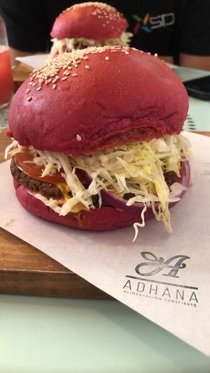 Hamburguesa con pan de betarraga, muy rico!  at Adhana in Santiago