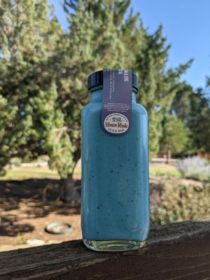 Blue majik colada in-house smoothie with coconut cream, pineapple, dates, lime juice, and blue spirulina at Great Basin Community Food Co-op in Reno