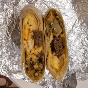 Just egg scramble, beyond meat sausage, violife colby jack, potatoes cooked in pesto at Great Basin Community Food Co-op in Reno