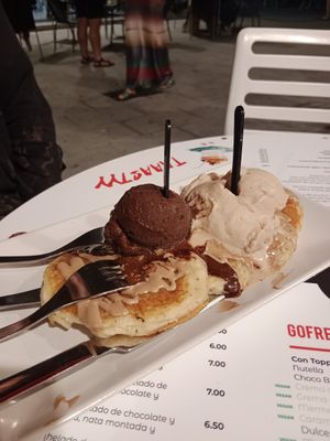 Delicious tortitas with ice cream and sauce at Vacanze Romane in Santander