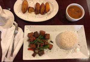 Vegan fried pork, red beans, rice, maduros at Lechonera El Coqui in Jacksonville