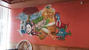 Inside wall art at Lechonera El Coqui in Jacksonville