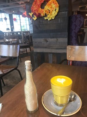 Tumeric latte which comes with almond milk and can be made with or without coffee at Wild Honey - Mandarin Gallery in Central Singapore