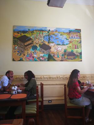 There's a room with regular chairs and tables available and one where you can sit at tables on the floor.  at Govindas Hare Krishna in Valparaiso