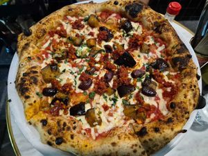 Harissa eggplant red pesto $31 w/vegan cheese +2: good harissa taste (bit spicy), good melty cheese, good crunchy garlic (but no taste). Soft base but nice bubbly crust. at Pizza Madre in Marrickville