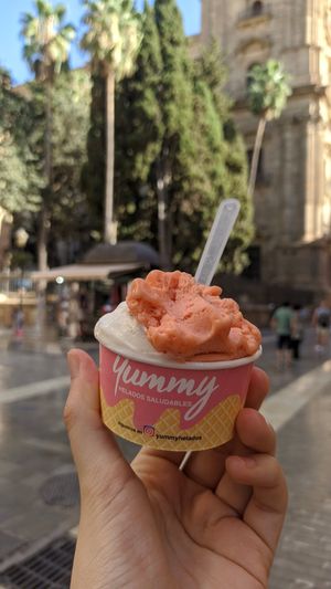 Creamy vanilla and fresh strawberry balls of ice cream at Yummy Helados in Malaga