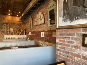 Booth seating, with rustic decorations that are common in all Bareburger locations. :-) at Bareburger in Bayside