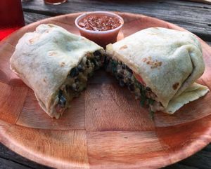 Spinach and black bean burrito w/ hot salsa! at Laughing Planet Cafe in Bloomington