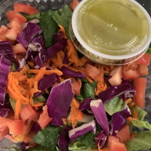 Side salad w/ lemon parsley vinaigrette  at Laughing Planet Cafe in Bloomington