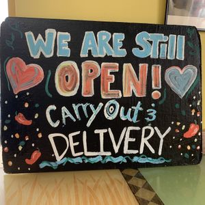 Still open at Laughing Planet Cafe in Bloomington