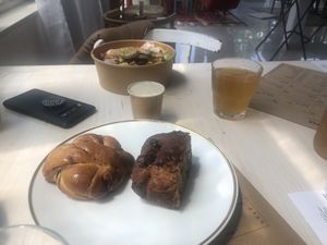 cinnamon roll, banana bread, sisa II (salad with tempeh) at Kucha in Ljubljana